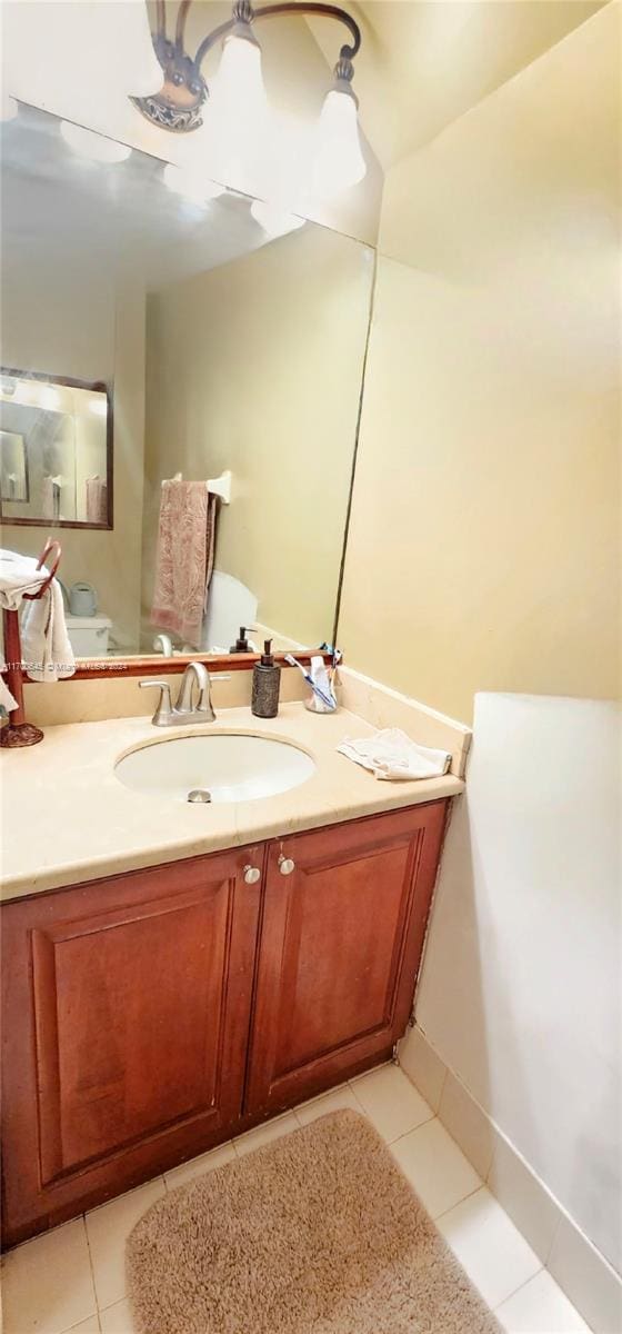 bathroom with tile patterned flooring and vanity