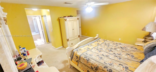 bedroom with ceiling fan and light colored carpet