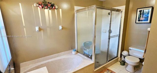 bathroom featuring separate shower and tub, tile patterned flooring, and toilet