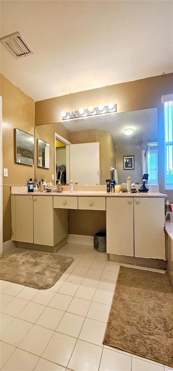 bathroom with vanity and tile patterned floors