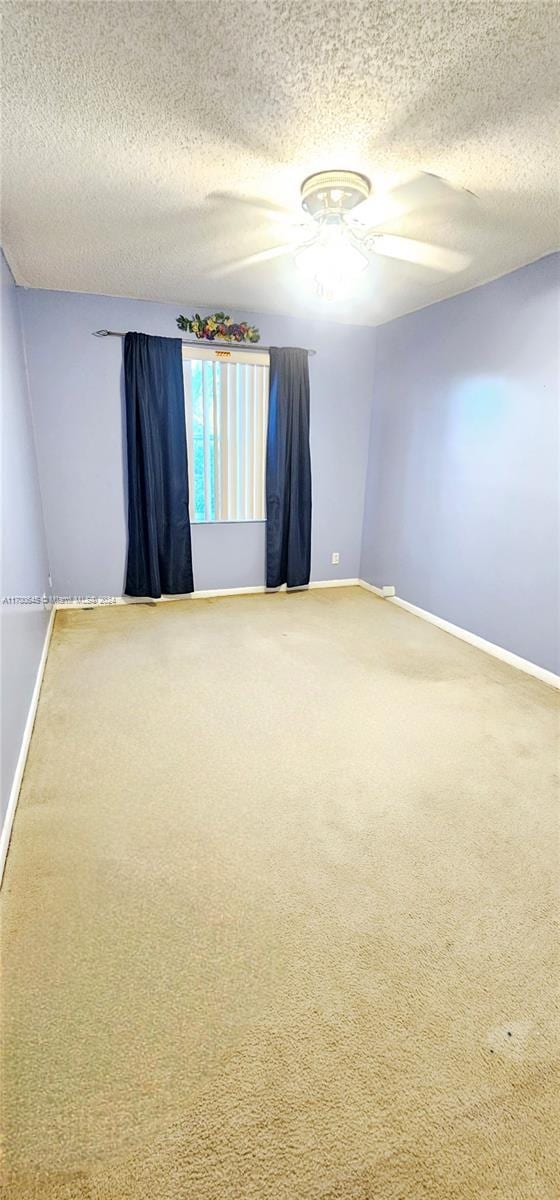 17352 SW 18th St, Miramar, FL 33029 - carpeted empty room with a textured ceiling and ceiling fan
