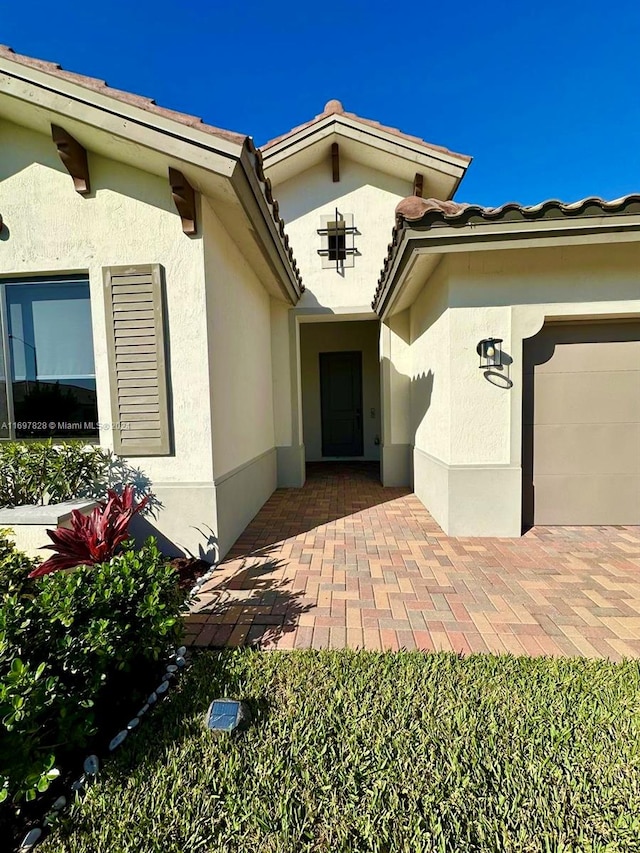 property entrance featuring a garage