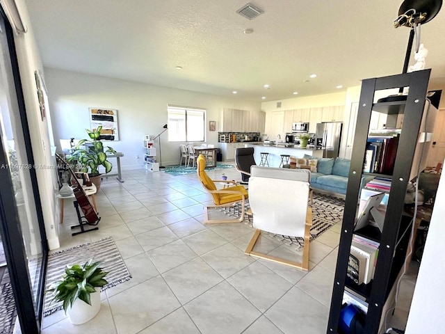 living room featuring light tile patterned floors