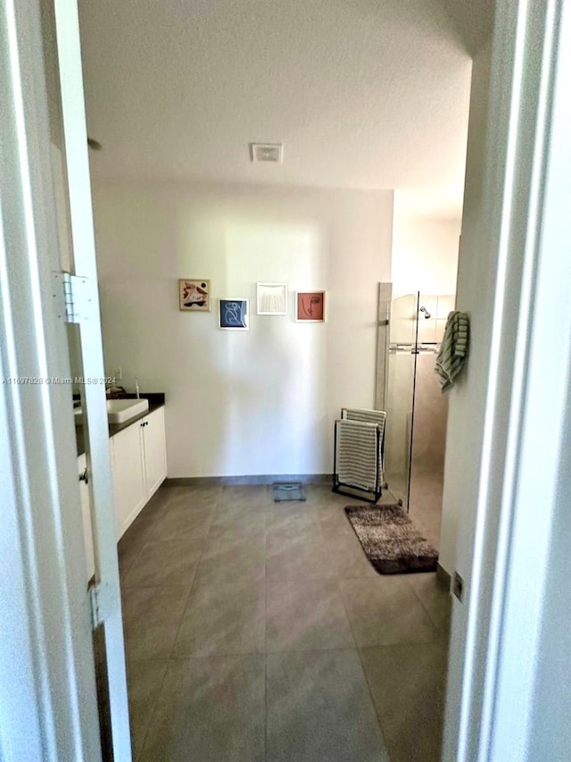 bathroom featuring vanity and a textured ceiling