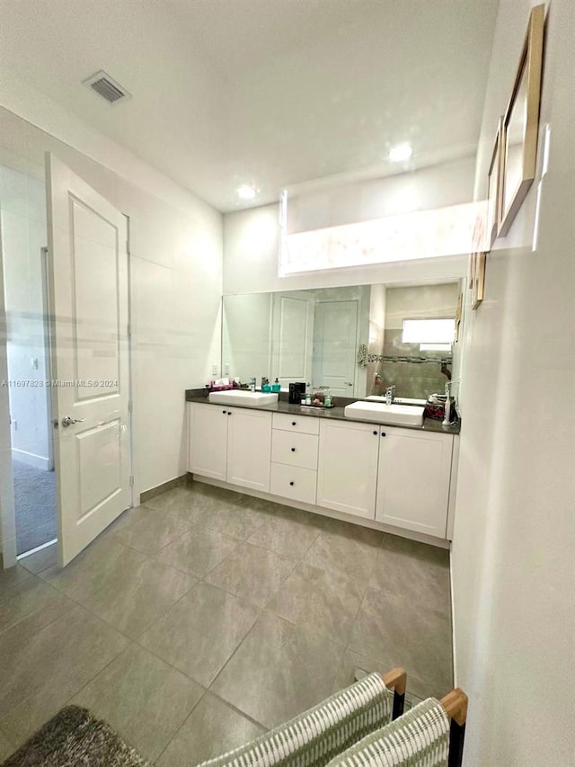 bathroom featuring tile patterned floors and vanity