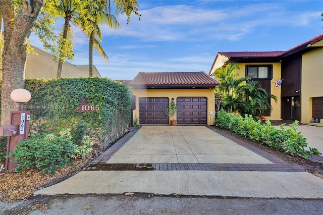 view of front of home with a garage