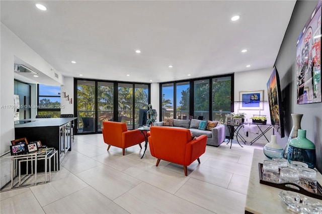 tiled living room featuring expansive windows