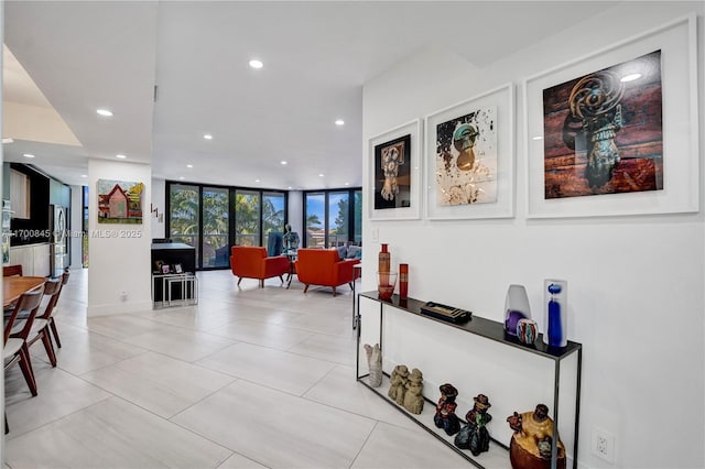 interior space featuring light tile patterned floors and expansive windows