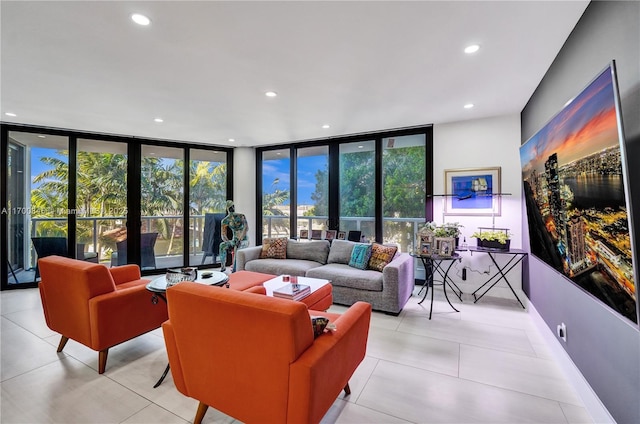 tiled living room featuring floor to ceiling windows and a wealth of natural light