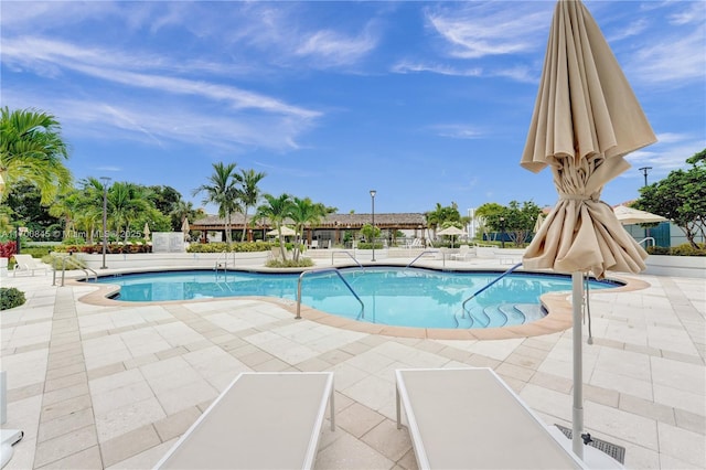 view of swimming pool with a patio