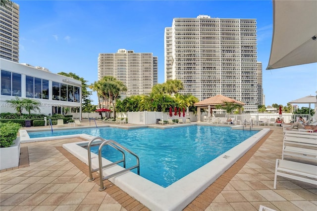 view of swimming pool with a gazebo and a patio