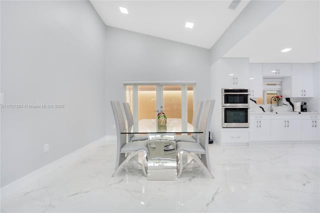 dining space with french doors, high vaulted ceiling, and sink