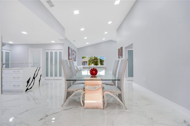 dining area featuring lofted ceiling