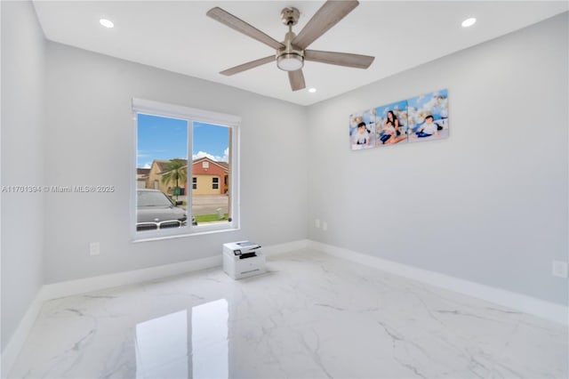 spare room with ceiling fan