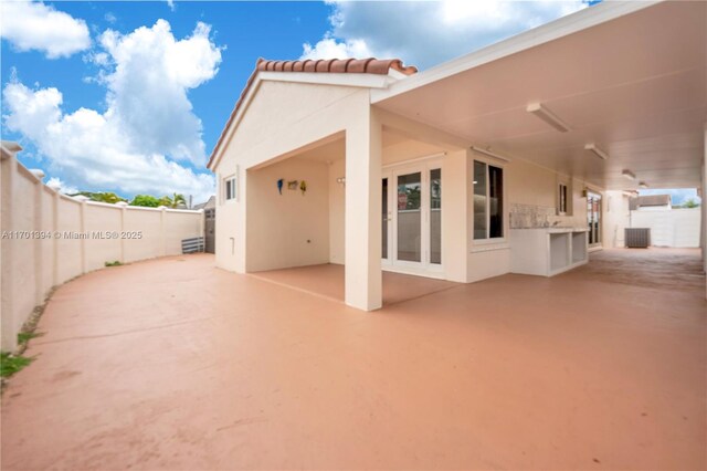 rear view of house featuring a patio