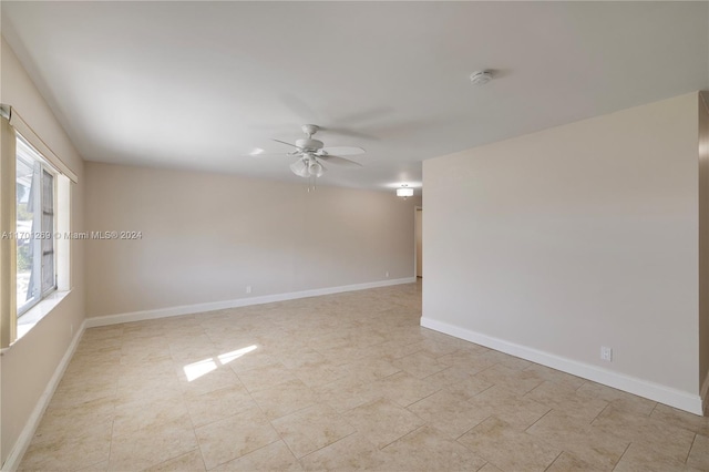 spare room with ceiling fan