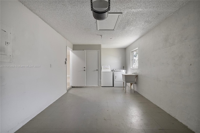 garage with washer and dryer and sink