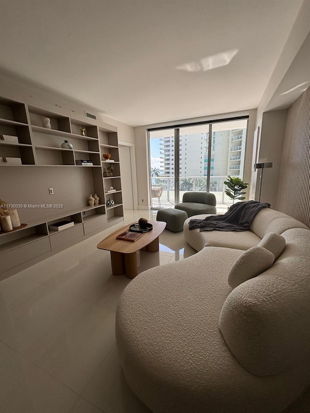 1300 Brickell Bay Dr Unit 604, Miami, FL 33131 - tiled living room featuring a wall of windows