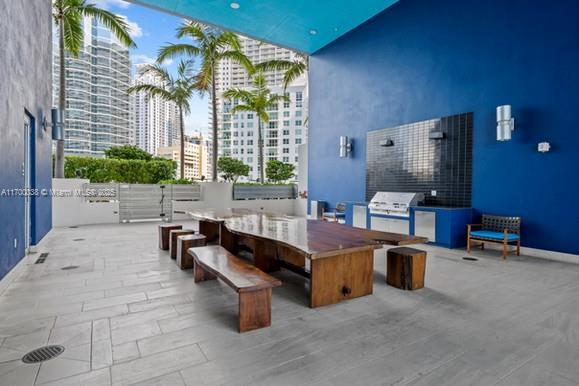 1300 Brickell Bay Dr Unit 604, Miami, FL 33131 - view of patio featuring a city view