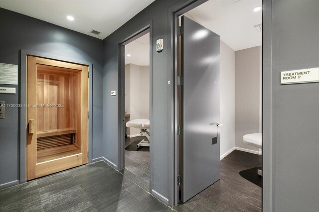 1300 Brickell Bay Dr Unit 604, Miami, FL 33131 - corridor with baseboards and recessed lighting