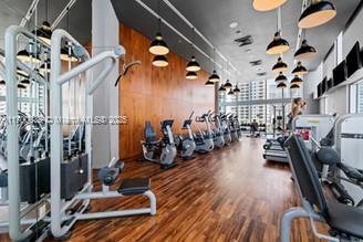 1300 Brickell Bay Dr Unit 604, Miami, FL 33131 - exercise room featuring wood finished floors