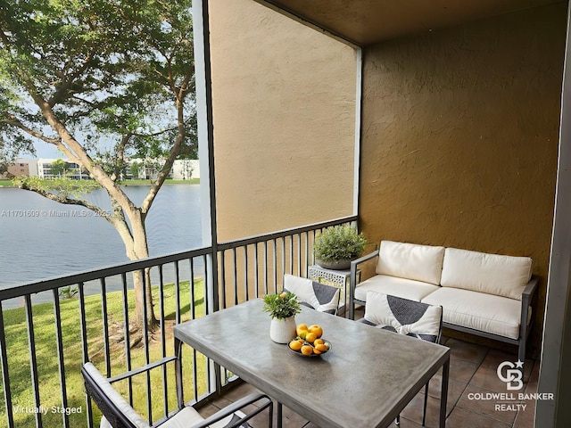 balcony featuring a water view