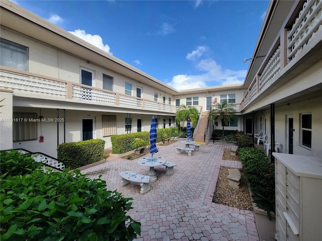 view of home's community featuring a patio