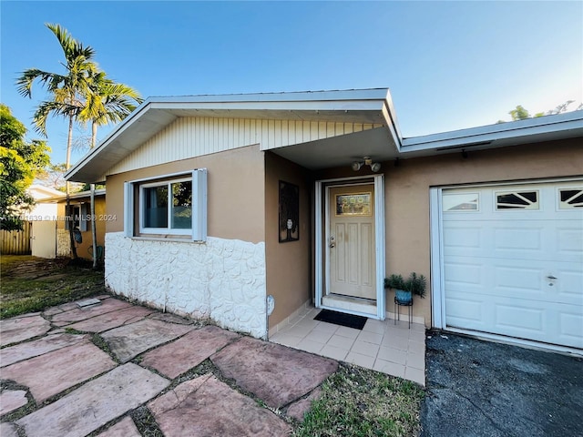 property entrance featuring a garage