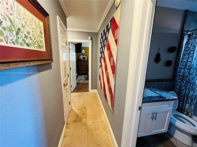 hallway featuring ornamental molding