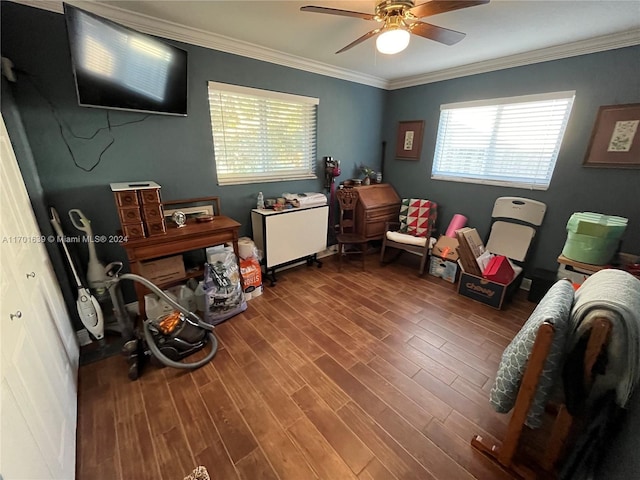 game room featuring wood-type flooring, ceiling fan, and ornamental molding