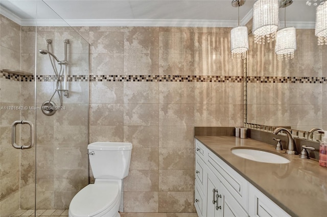 bathroom with crown molding, toilet, vanity, a shower with shower door, and tile walls