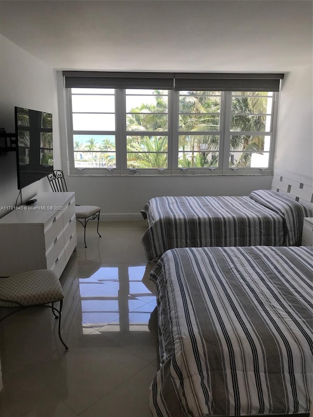 bedroom featuring tile patterned flooring