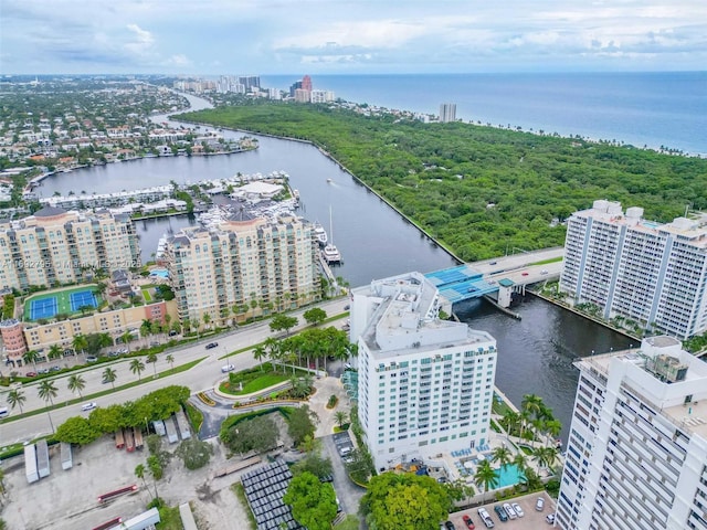 birds eye view of property with a water view and a city view