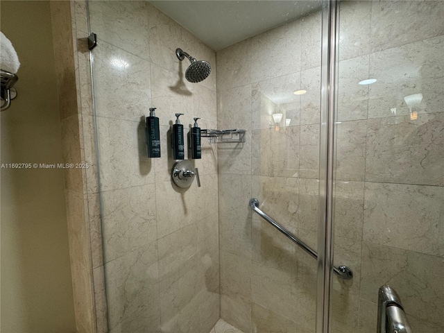 full bath with a shower stall