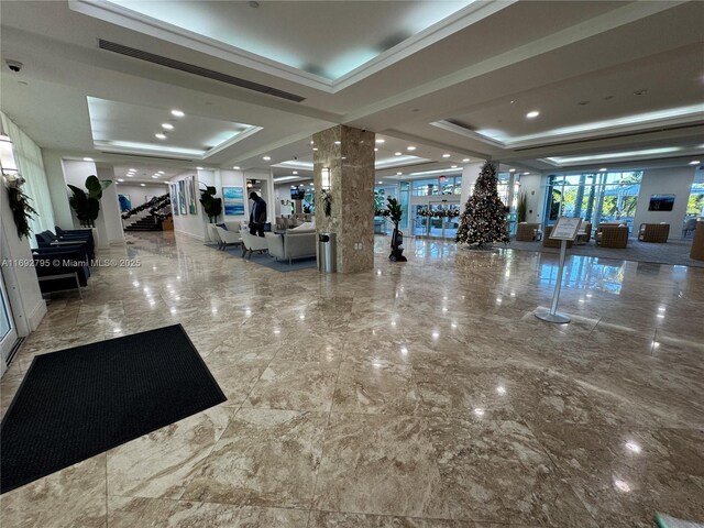 carpeted dining area with a towering ceiling