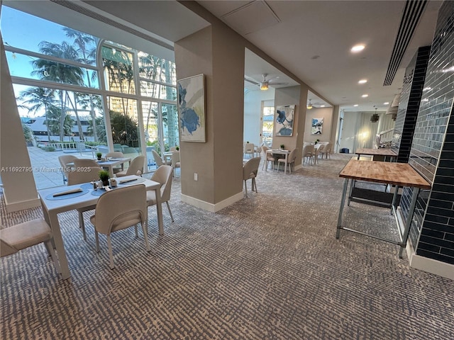 carpeted dining room featuring plenty of natural light, baseboards, ceiling fan, and recessed lighting