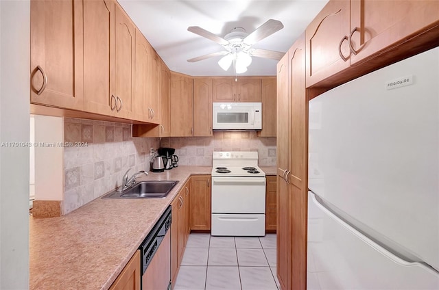 kitchen featuring white appliances, sink, ceiling fan, light tile patterned floors, and tasteful backsplash