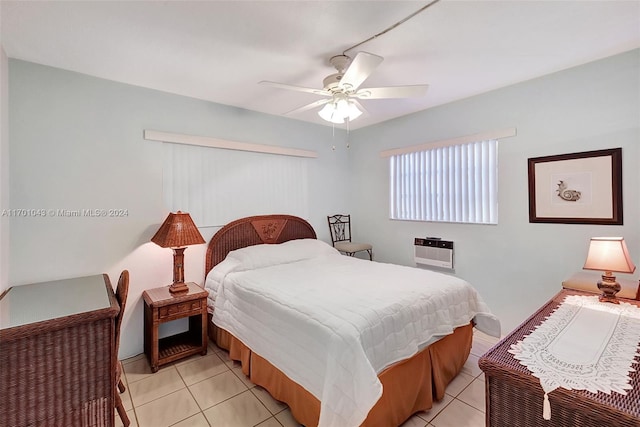 tiled bedroom with ceiling fan and heating unit