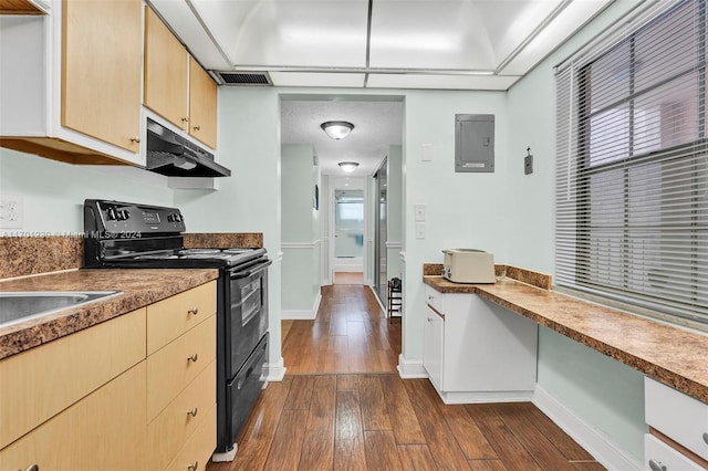 kitchen featuring black electric range, light brown cabinets, dark hardwood / wood-style flooring, and electric panel