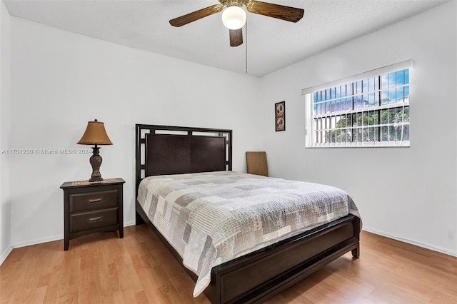 bedroom featuring ceiling fan and light hardwood / wood-style flooring