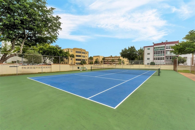 view of tennis court featuring basketball court