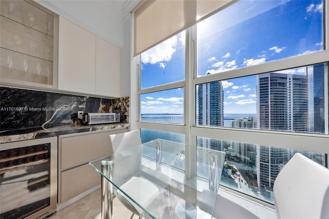 interior space featuring wine cooler, a toaster, and a view of city