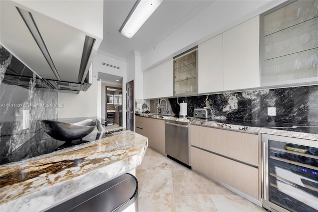 kitchen featuring beverage cooler, tasteful backsplash, modern cabinets, stainless steel dishwasher, and a sink