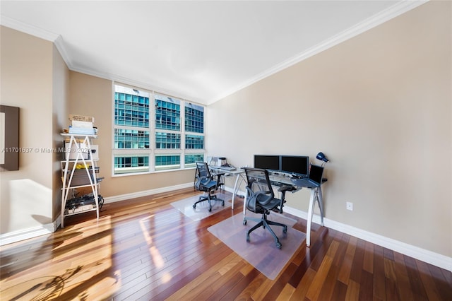 home office with hardwood / wood-style flooring and crown molding