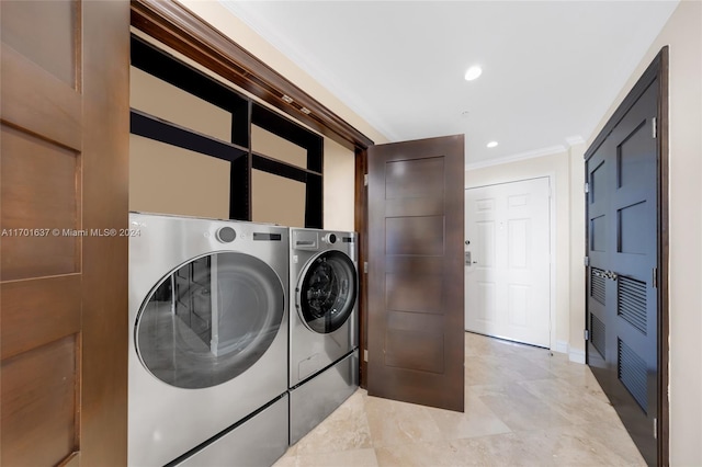 clothes washing area with independent washer and dryer and ornamental molding