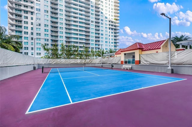 view of sport court with community basketball court and fence