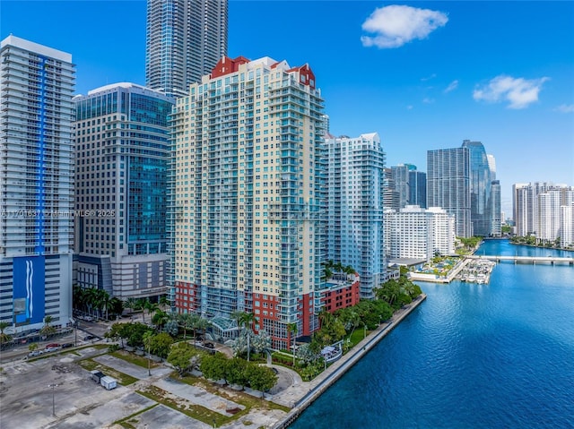 drone / aerial view with a view of city and a water view