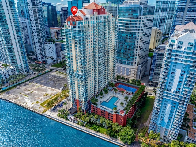 drone / aerial view featuring a water view and a view of city