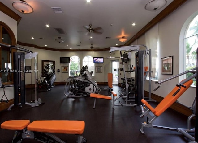 exercise room featuring ceiling fan and crown molding