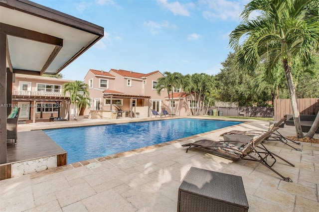 view of swimming pool with a patio